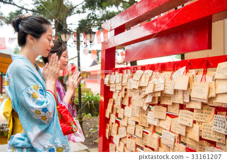 Woman girlfriends close eyes praying. 33161207