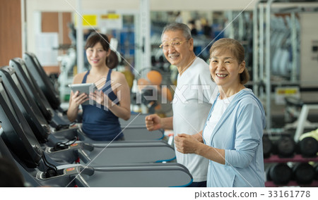 Active senior running machine gym training image 33161778