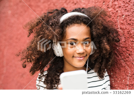 Beautiful african american girl with smart phone 33162269