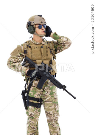 Soldier talking portable radio station.  33164609
