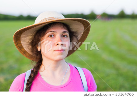 Close up portrait woman with freckles in summer 33164700