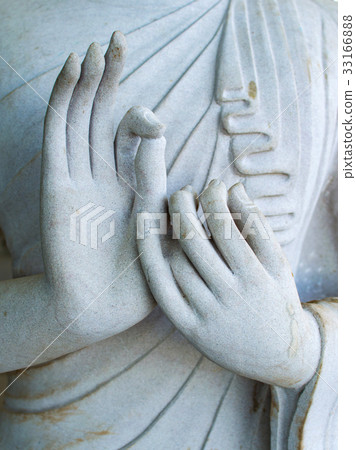 Detail of a white statue of the Buddha Detail of a white statue of the Buddha 33166888