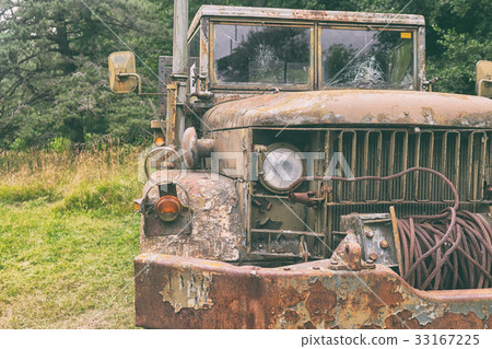 Old army truck in the woods Old army truck in the woods 33167225