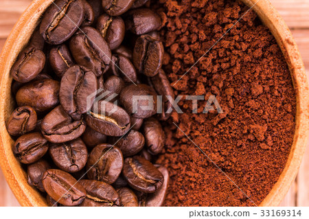 roasted brown coffee beans and powder roasted brown coffee beans and powder 33169314