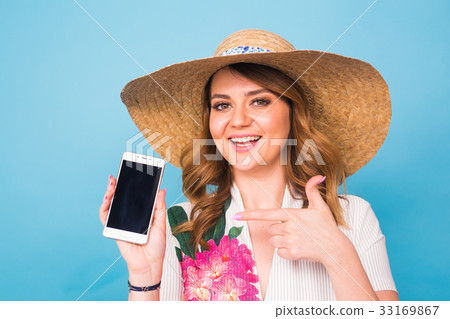 Happy smiling woman showing cell phone with black Happy smiling woman showing cell phone with black 33169867