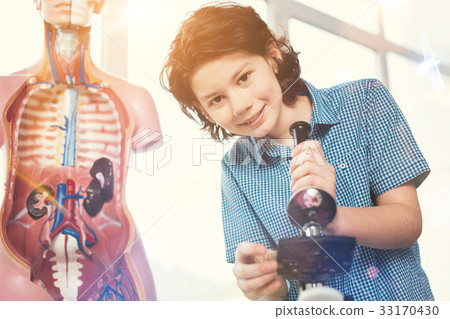 Low angle photo of teenager that posing on camera 33170430