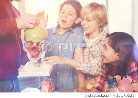 Positive group of pupils visiting class with 33170525