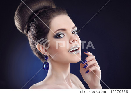 Makeup and manicure. Beauty portrait of young 33170788