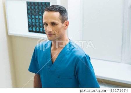 Handsome doctor standing in his CT scan lab 33171974