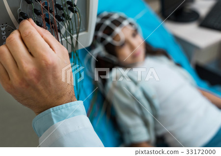 Close up of doctors hand setting up 33172000