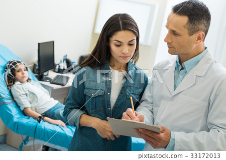 Mother telling doctor about her daughters medical 33172013