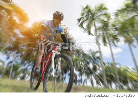 Sportsman cycling bicycle from high, radial blur Sportsman cycling bicycle from high, radial blur 33172350
