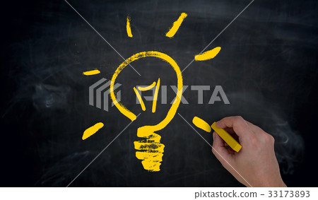 Light bulb is painted by hand on blackboard 33173893