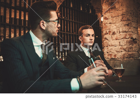 Young gentlemen tasting craft beer 33174143