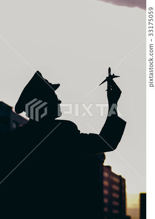 Pilot holds the model of the airplane 33175059