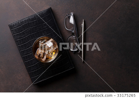 Whiskey with ice and business office supplies Whiskey with ice and business office supplies 33175265