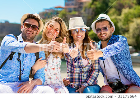 Group of friends taking funny portraits outdoor Group of friends taking funny portraits outdoor 33175664