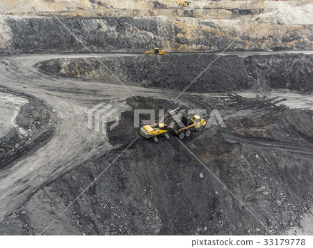 Aerial view open pit mine, loading of rock, mining Aerial view open pit mine, loading of rock, mining 33179778