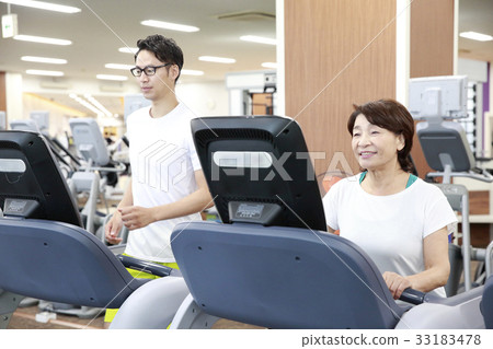 Men and women walking in a sports club Men and women walking in a sports club 33183478