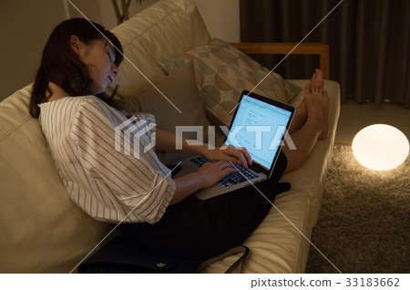 Woman snoozing on the couch 33183662