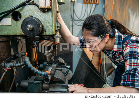 factory woman wearing safety protection glasses factory woman wearing safety protection glasses 33185382