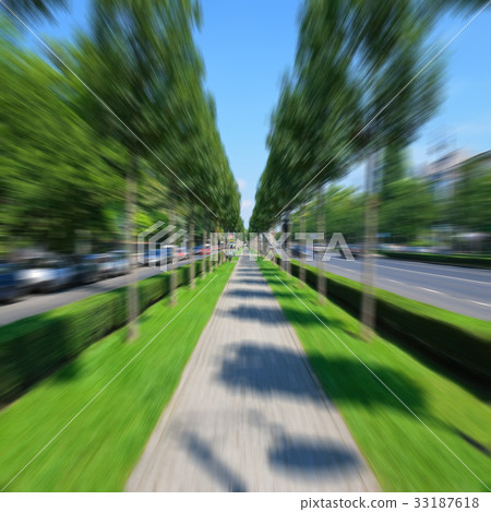 Bicycling by the empty alley 33187618