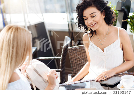 Happy beautiful woman looking at the bag 33190147