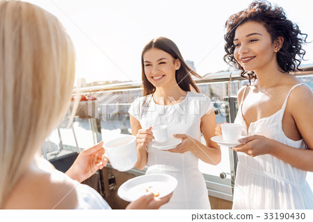 Positive delighted friends meeting for tea Positive delighted friends meeting for tea 33190430