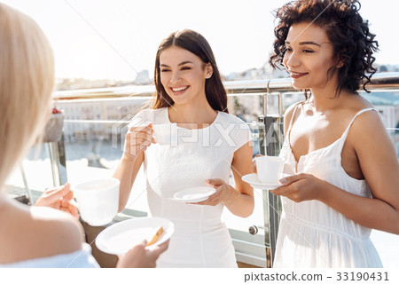 Delighted young women enjoying their time together Delighted young women enjoying their time together 33190431