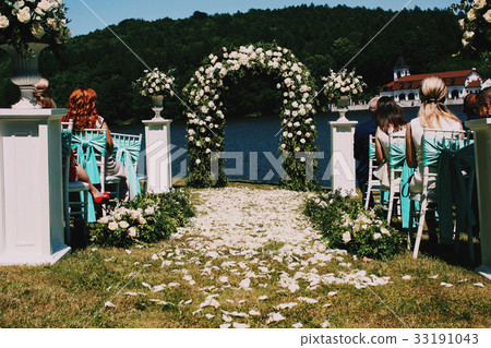 Path to wedding altar covered with white petals 33191043