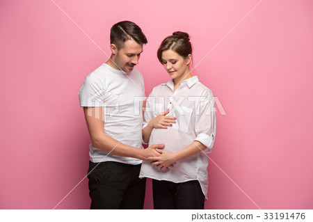 Handsome man is listening to his beautiful Handsome man is listening to his beautiful 33191476