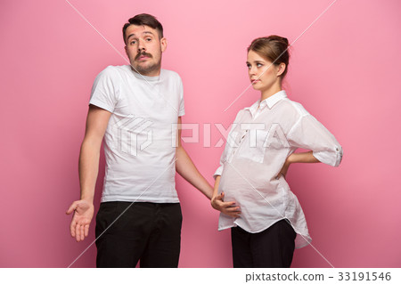 The funny surprised handsome man and his beautiful 33191546