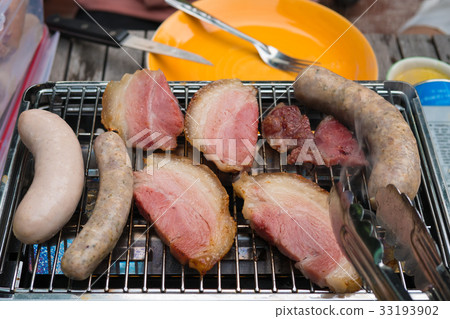 Ham and sausage barbecue grill on oven 33193902