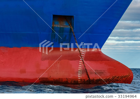 Blue cargo ship moored 33194964