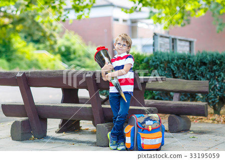 little kid boy with school satchel on first day to little kid boy with school satchel on first day to 33195059