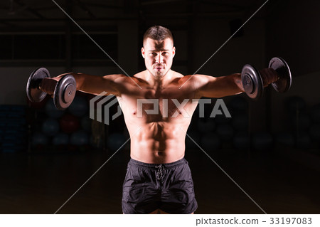Muscular bodybuilder guy doing exercises with Muscular bodybuilder guy doing exercises with 33197083