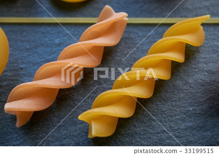 extreme closeup of two colored pasta extreme closeup of two colored pasta 33199515