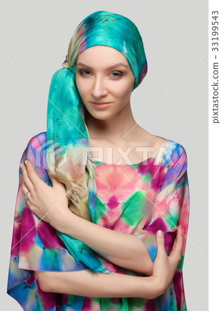 Fashion model in colorful silk blouse and scarf Fashion model in colorful silk blouse and scarf 33199543