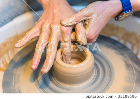 Pottering - creating a clay cup in process 33199590