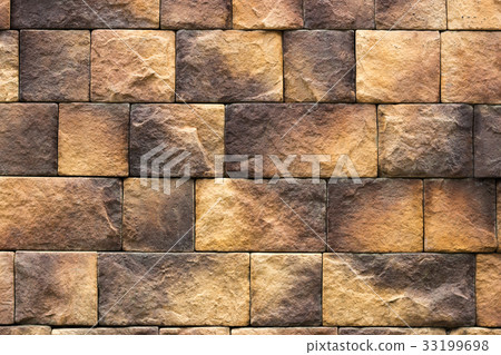 Brown and orange stone wall tiles texture. Brown and orange stone wall tiles texture. 33199698