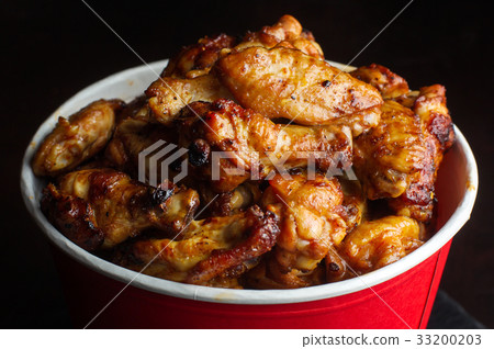 Chicken legs in a bucket. Chicken legs in a bucket. 33200203