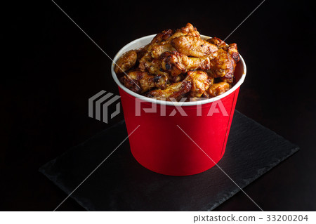 Chicken legs in a bucket. Chicken legs in a bucket. 33200204