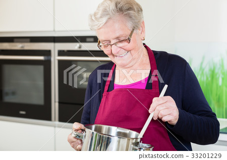 Grandma cooking comfort food  33201229