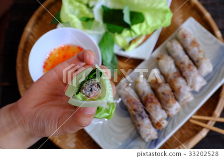 Eating spring roll pastry Eating spring roll pastry 33202528