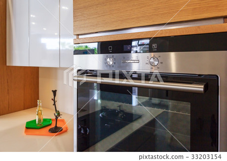 Kitchen cabinets and built-in electric oven 33203154