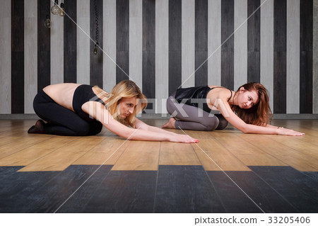 yoga lesson. Young beautiful female instructor 33205406