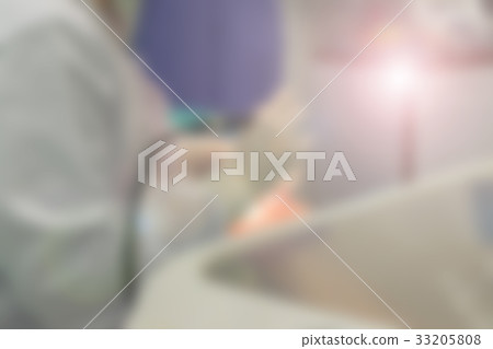 Blurred of Dentist working 33205808