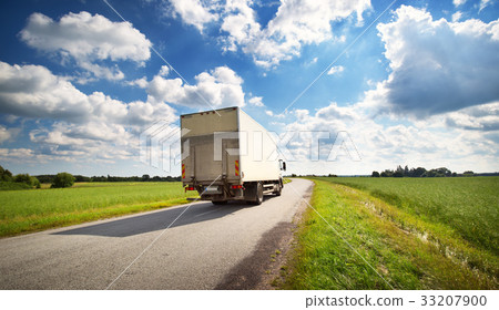 lorry moving on sunny evening 33207900