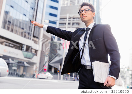 Waving for a taxi in city Waving for a taxi in city 33210960