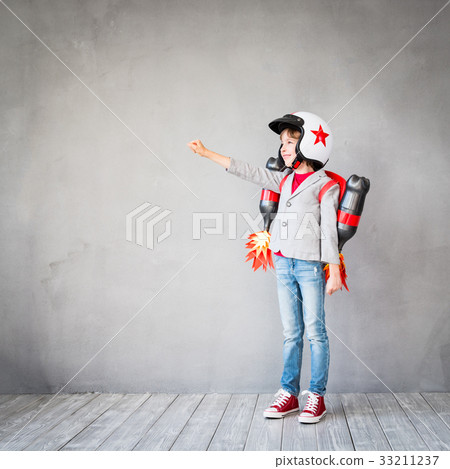Kid playing with jet pack at home Kid playing with jet pack at home 33211237